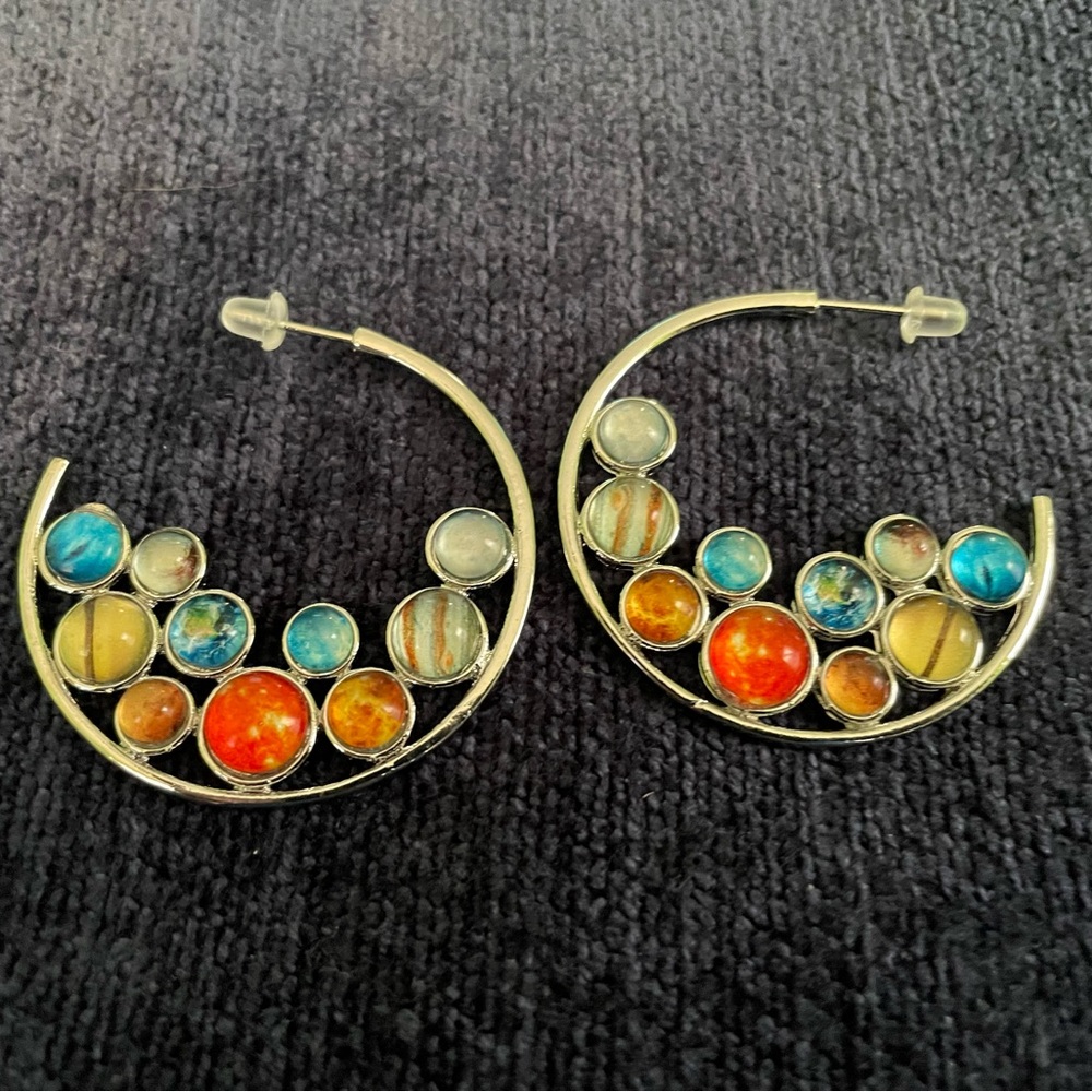 Silver tone and fun jewel colors in a pair of hoop earrings perfect for summer!